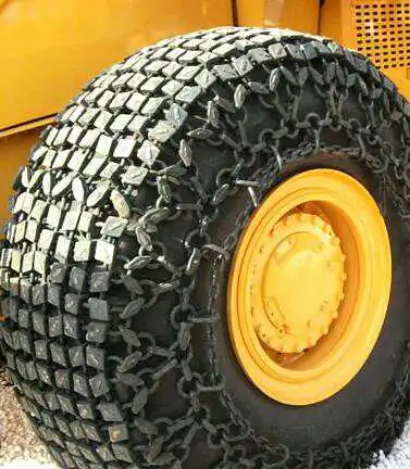 Why is forging the preferred process for chain plates in loader tire anti-skid tracks?